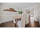 Bright dining room with hardwood floors and seating for six at H-5422 Hill Sw Rd, Powder Springs, GA 30127