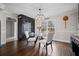 Well lit dining room with a glass table, hardwood floors, and decorative accents at H-5422 Hill Sw Rd, Powder Springs, GA 30127