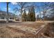 A spacious front yard with a well-kept lawn and a charming gazebo in the background at H-5422 Hill Sw Rd, Powder Springs, GA 30127