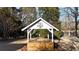 A cute gazebo is surrounded by lush greenery, offering a peaceful retreat at H-5422 Hill Sw Rd, Powder Springs, GA 30127