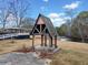 Picturesque gazebo located by the water, offering a tranquil retreat with natural surroundings at H-5422 Hill Sw Rd, Powder Springs, GA 30127