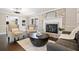 Inviting living room features a brick fireplace and elegant seating arrangement at H-5422 Hill Sw Rd, Powder Springs, GA 30127
