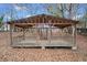 Outdoor pavilion featuring a metal roof and wooden frame, perfect for gatherings and relaxation at H-5422 Hill Sw Rd, Powder Springs, GA 30127