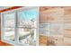 Close-up of the accent wall with wooden wine crates, and a window with a view of the property at H-5422 Hill Sw Rd, Powder Springs, GA 30127