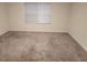 A bright and airy bedroom with neutral carpet and plenty of natural light at 3568 Eagle Sw Ct, Atlanta, GA 30331