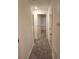 Hallway featuring neutral paint with carpeted floors connecting bedrooms at 3568 Eagle Sw Ct, Atlanta, GA 30331