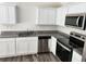 Bright kitchen with white cabinets, stainless steel appliances, and granite countertops at 3568 Eagle Sw Ct, Atlanta, GA 30331