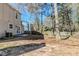 Back of the house featuring a patio, windows for natural light, and a yard at 6218 Creekford Ln, Lithonia, GA 30058