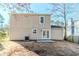 Back of the house featuring a patio, windows for natural light, and a yard at 6218 Creekford Ln, Lithonia, GA 30058