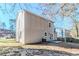 Back of the house featuring a patio, windows for natural light, and a yard at 6218 Creekford Ln, Lithonia, GA 30058