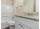 Bathroom featuring a granite counter, white cabinets, and a shower and tub combination at 6218 Creekford Ln, Lithonia, GA 30058