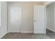 Bedroom featuring carpeted floors with ample closet space with white doors and trim at 6218 Creekford Ln, Lithonia, GA 30058