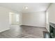 Bright living room featuring hardwood flooring and a fireplace at 6218 Creekford Ln, Lithonia, GA 30058