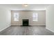 Spacious living room with hardwood flooring and a fireplace at 6218 Creekford Ln, Lithonia, GA 30058