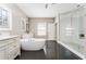 Bathroom featuring a soaking tub, dual sink vanity, and separate glass door shower at 6669 Encore Blvd, Atlanta, GA 30328