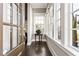 Light-filled entryway with windows shows off the stylish door and flower arrangement at 6669 Encore Blvd, Atlanta, GA 30328