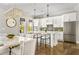 Bright kitchen features white cabinets, stainless steel appliances, and a large island with bar seating at 6669 Encore Blvd, Atlanta, GA 30328