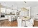 Spacious kitchen featuring white cabinets, quartz countertops, and eat-in island at 6669 Encore Blvd, Atlanta, GA 30328