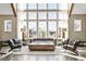 Living room featuring high ceilings, large windows, and elegant decor at 6669 Encore Blvd, Atlanta, GA 30328