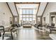 Grand lobby features soaring ceilings, large windows, wood beams, hardwood floors, and comfortable seating at 6669 Encore Blvd, Atlanta, GA 30328