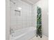 Bright bathroom features a tiled shower with a sleek showerhead at 772 Verde Dr, Riverdale, GA 30274