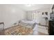 Cozy bedroom with natural light, hardwood floors, and door to outdoor deck at 772 Verde Dr, Riverdale, GA 30274