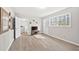 Spacious bonus room featuring light colored walls, light wood floors and large windows overlooking the exterior at 772 Verde Dr, Riverdale, GA 30274