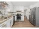 Functional kitchen featuring stainless steel appliances, durable countertops, and plenty of storage space at 772 Verde Dr, Riverdale, GA 30274