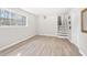 Spacious room with wood flooring, natural light, and staircase to the upper level at 772 Verde Dr, Riverdale, GA 30274