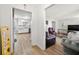 Cozy living room featuring hardwood floors and modern finishes, open to the kitchen at 772 Verde Dr, Riverdale, GA 30274