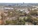 An aerial view of condos nestled among the trees with the city skyline in the background at 806 Lismore Se, Smyrna, GA 30080