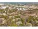 An aerial view captures the neighborhood's blend of lush trees and modern apartment buildings at 806 Lismore Se, Smyrna, GA 30080