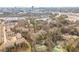 Aerial view featuring condos nestled among trees with the city skyline in the background at 806 Lismore Se, Smyrna, GA 30080