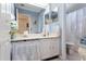 Bathroom with a white vanity, vintage lace detail, and blue walls at 806 Lismore Se, Smyrna, GA 30080