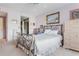 Relaxing bedroom featuring a wrought-iron bed and framed art at 806 Lismore Se, Smyrna, GA 30080