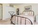 Bedroom features closet, bed with gold frame, exercise machine, and neutral walls at 806 Lismore Se, Smyrna, GA 30080