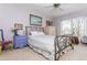 Charming bedroom featuring a decorative metal bed frame, lilac walls, and bright natural light at 806 Lismore Se, Smyrna, GA 30080