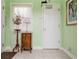 Welcoming foyer with light green walls, decorative decor, and tile floors for an inviting entrance at 806 Lismore Se, Smyrna, GA 30080