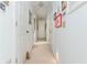 Hallway features white doors, neutral carpet and bright overhead lighting at 806 Lismore Se, Smyrna, GA 30080