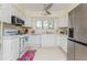 Bright kitchen features white appliances and lots of counter space at 806 Lismore Se, Smyrna, GA 30080