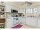 Kitchen with white appliances, countertops, and cabinets at 806 Lismore Se, Smyrna, GA 30080