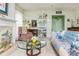 Cozy living room with a glass coffee table, a white fireplace and a colorful sofa at 806 Lismore Se, Smyrna, GA 30080