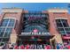 Exterior daytime view of the Right Field Gate entrance at SunTrust Park, filled with people and excitement at 806 Lismore Se, Smyrna, GA 30080