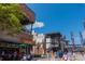 Outdoor view of a bustling town center with restaurants, shops, and people enjoying a sunny day at 806 Lismore Se, Smyrna, GA 30080