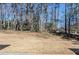 Serene backyard featuring mature trees, offering privacy and a natural setting at 2419 Leslie Brook Dr, Decatur, GA 30035