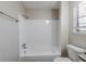 A clean bathroom featuring a tub and toilet at 2419 Leslie Brook Dr, Decatur, GA 30035