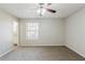 Bedroom with neutral walls and carpet featuring an open bath at 2419 Leslie Brook Dr, Decatur, GA 30035