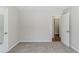 Bedroom with neutral walls and carpet with an open door at 2419 Leslie Brook Dr, Decatur, GA 30035