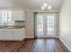 Dining area featuring granite counters, white cabinets, and access to the backyard through glass doors at 2419 Leslie Brook Dr, Decatur, GA 30035