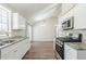 Bright kitchen featuring stainless steel appliances, granite counters, and ample cabinet space at 2419 Leslie Brook Dr, Decatur, GA 30035